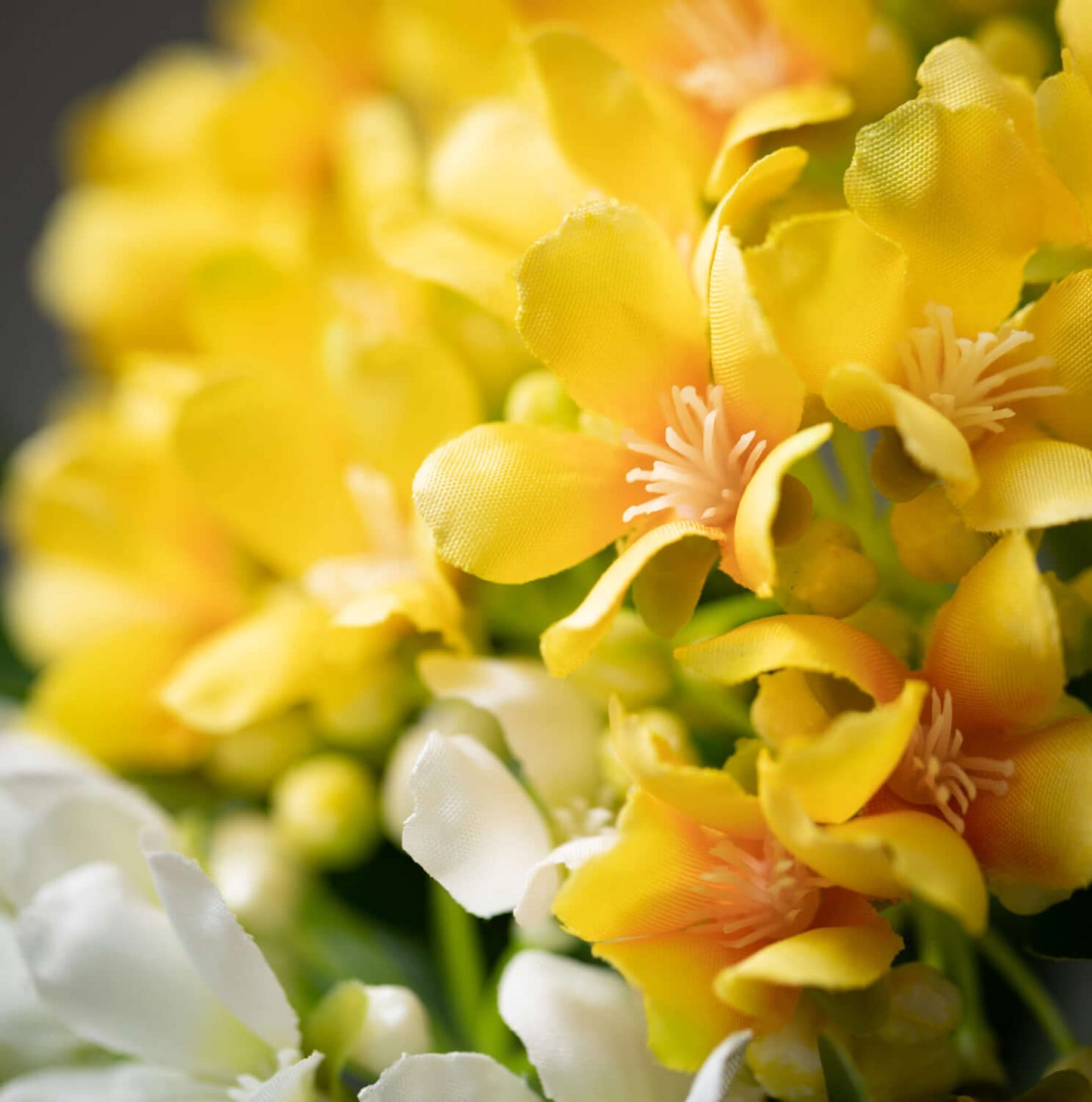 close-up of artificial yellow flowers.