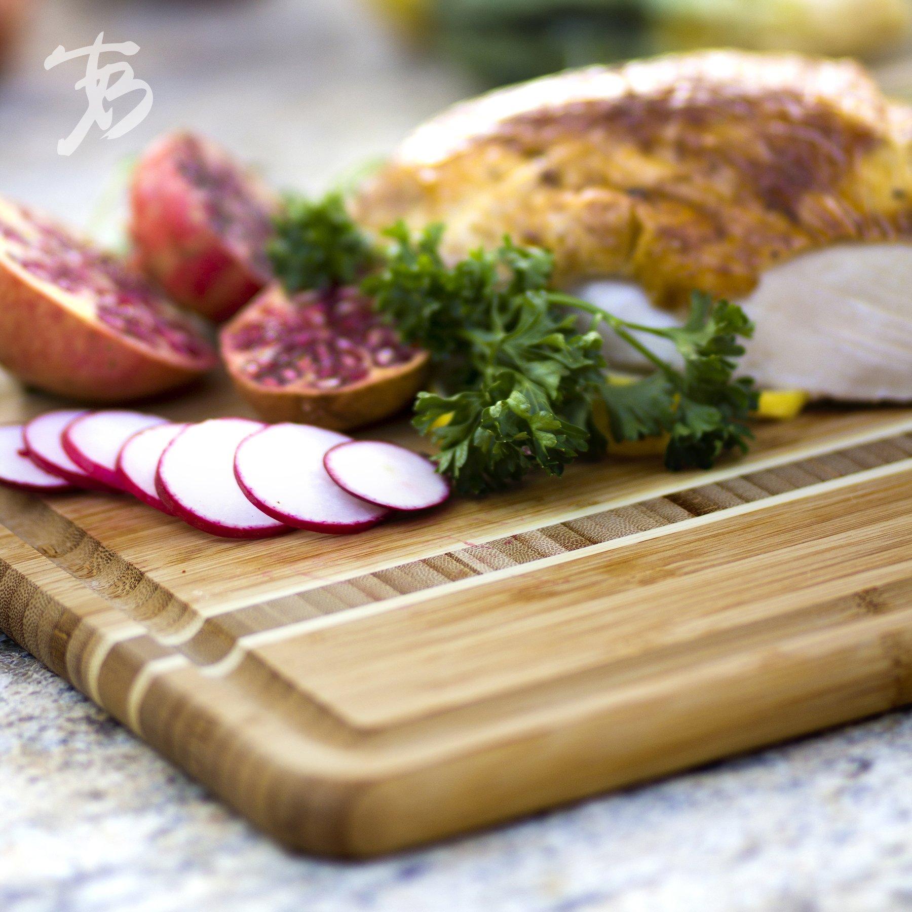 wood board arranged with meat, pomegranates, radishes, and parsley.