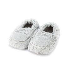 light grey plush slippers on white background.