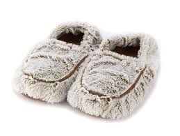 brown plush slippers on white background.