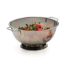 colander filled with strawberries.