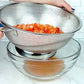 colander straining diced tomatoes.