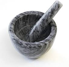 mortar with pestle in it.