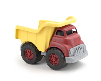the red and yellow dump truck on a white background