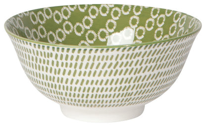 white ceamic bowl with green dahes on the exterior and green with white circles on the interior.