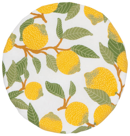 top view of small bowl cover that is white with yellow lemons an dgreen leaves.