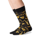 side view of a man wearing the jazz instruments crew socks on a white background