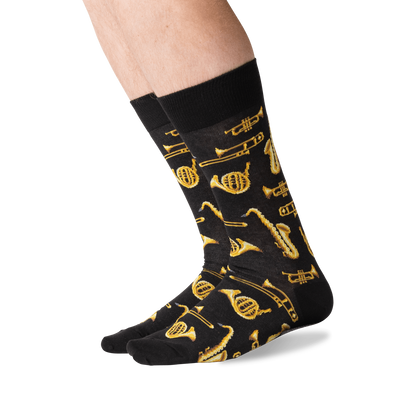 side view of a man wearing the jazz instruments crew socks on a white background