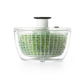 side view of salad spinner filled with greens.
