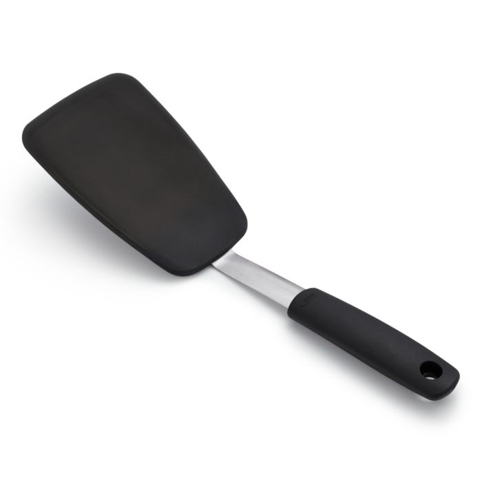 side view of spatula with black handle and head.