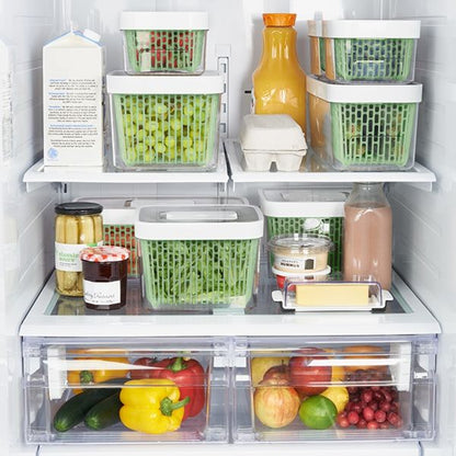 assorted sizes of greensaver stacked in refrigerator.