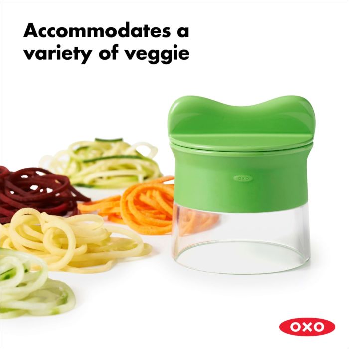 spiralizer with piles of assorted veggies and text "accommodates a variety of veggies".
