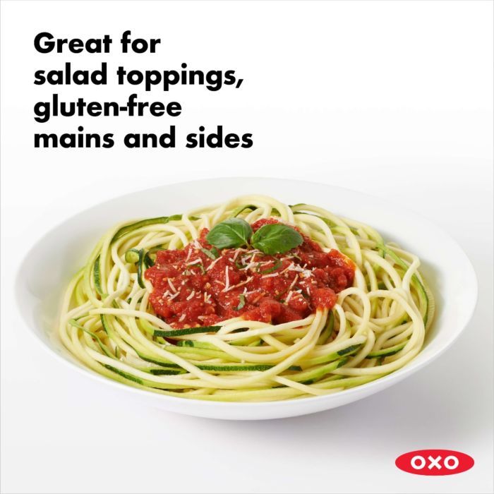 plate of spiralized zucchini and tomato sauce with text "great for salad toppings, gluten free mains & sides".
