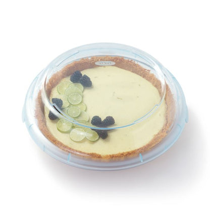 key lime pie in pie pan with lid on it.