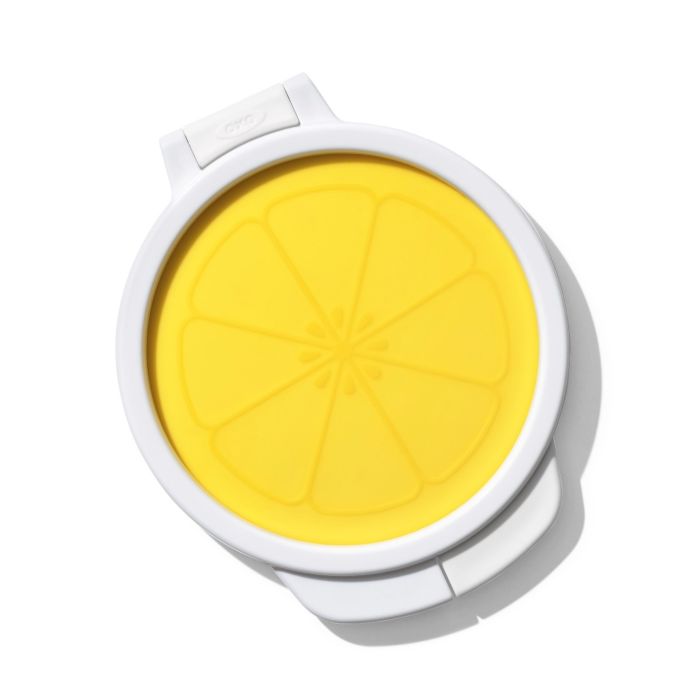 white lemon saver with yellow silicone top.