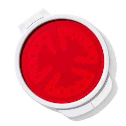 white tomato saver with red silicone top.