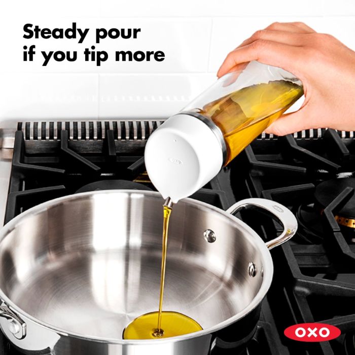 hand pouring oil into pot with text "steady pour if you tip more".