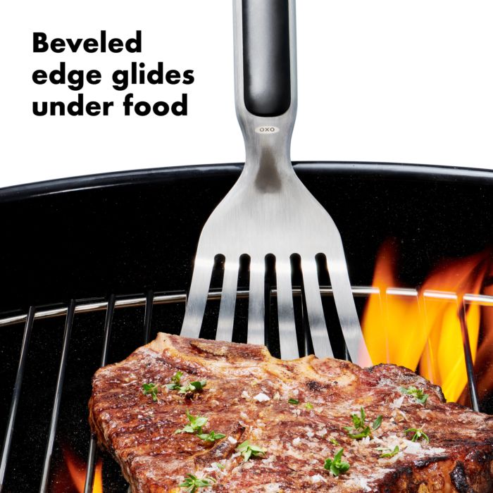 turner scooping up meat on grill with text "beveled edge glides under food".