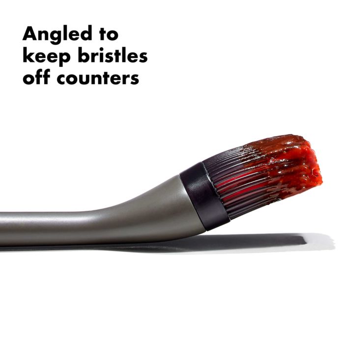 side view of brush with text "angled to keep bristles off counters"