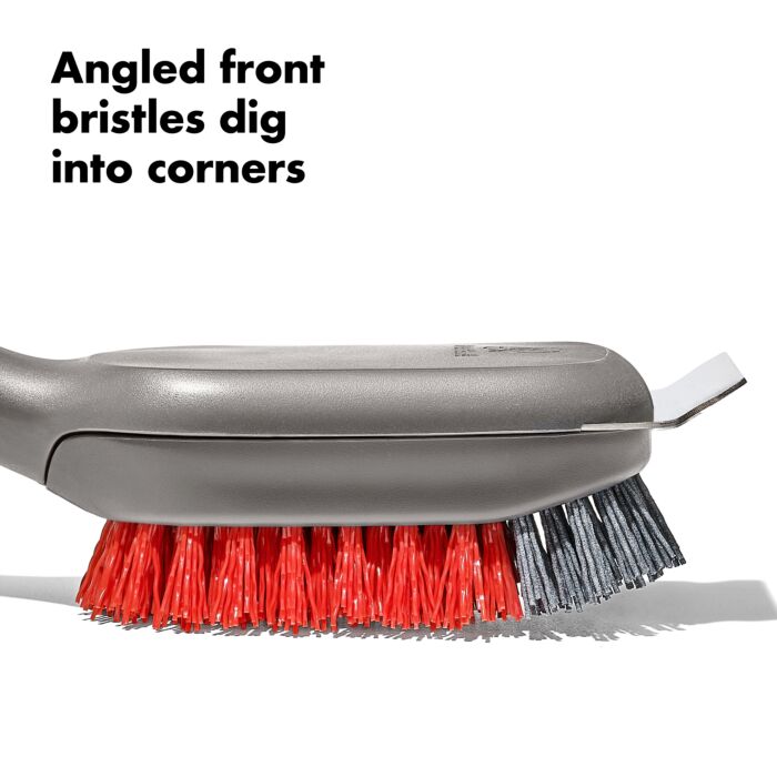 close-up of brush head with text "angled front bristles dig into corners".