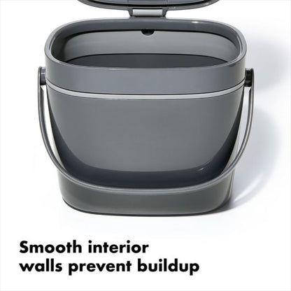 compost bucket open with text "smooth interior walls prevent buildup".