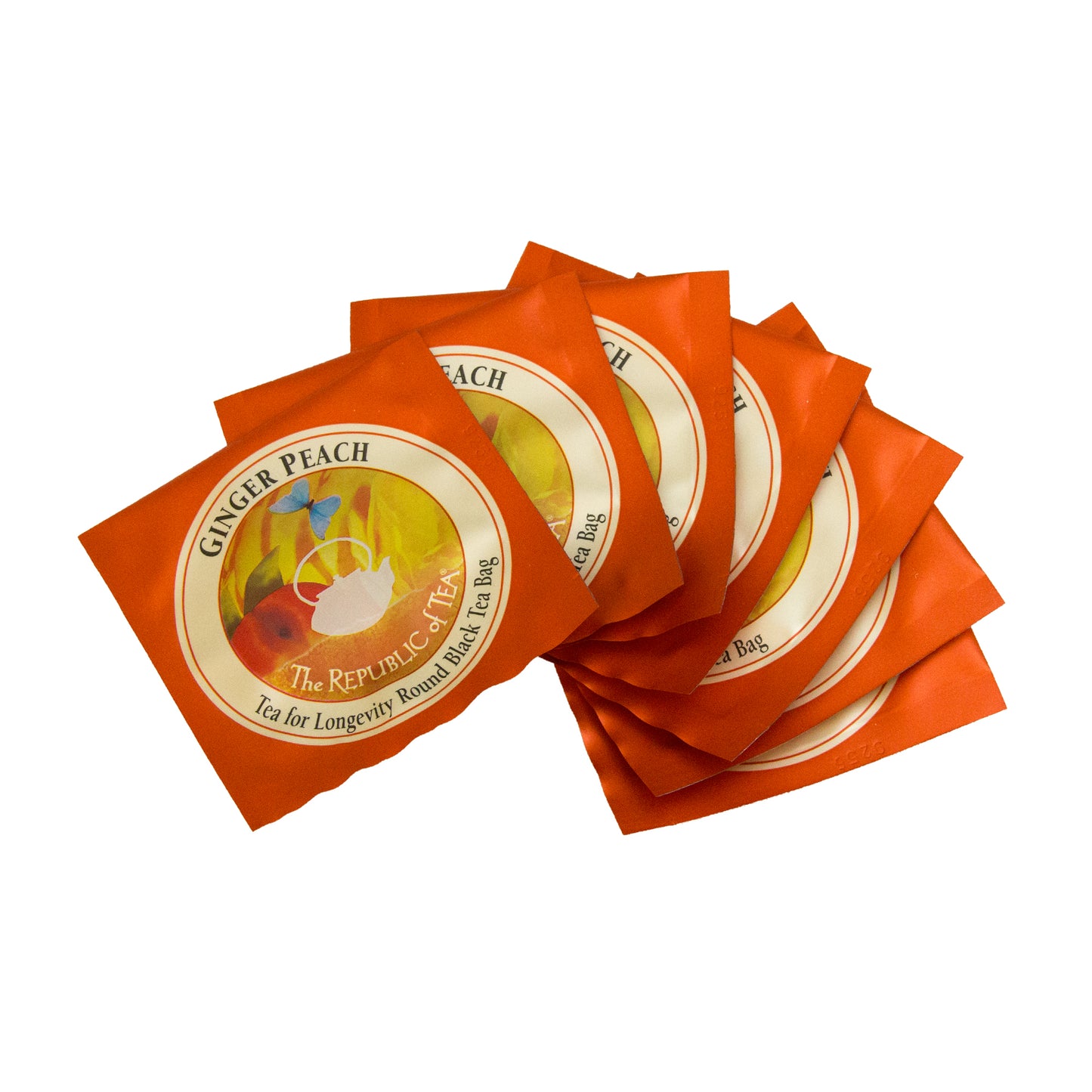individual packets of ginger peach black tea scattered on a white background