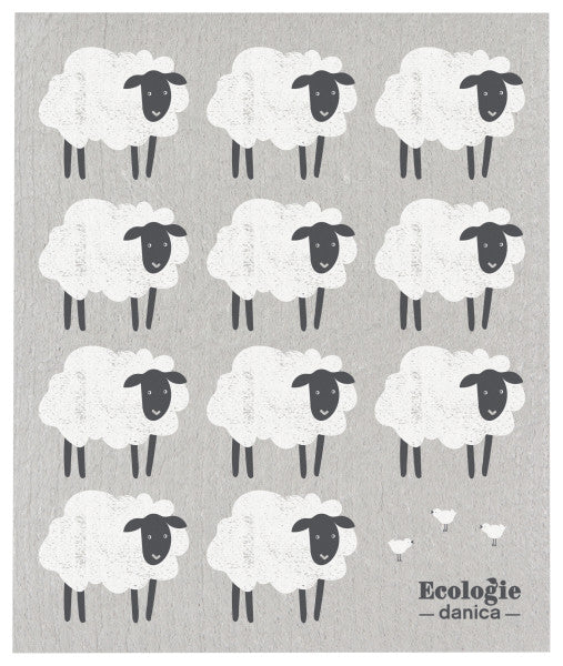 swedish dishcloth with grey background and sheep graphics on it.