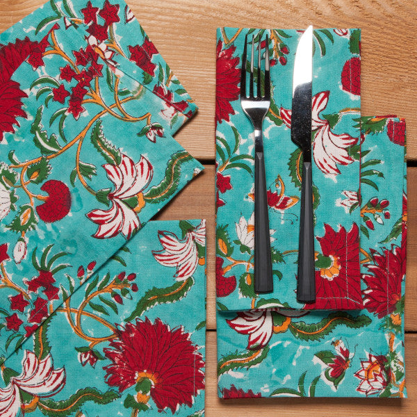 napkins folded and arranged with knife and fork.