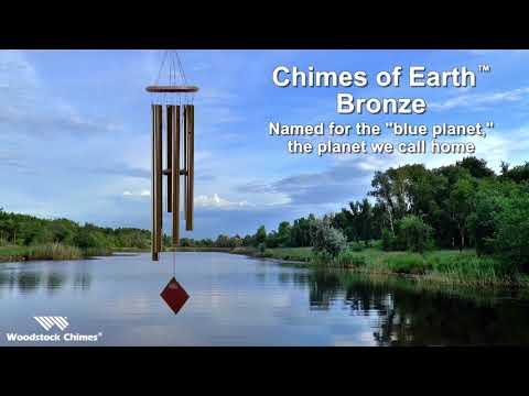 video of chime sound with woodland lake in background.