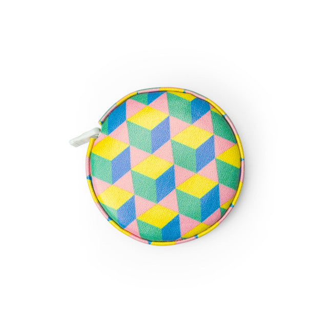 yellow green and blue mini tape measure on a white background