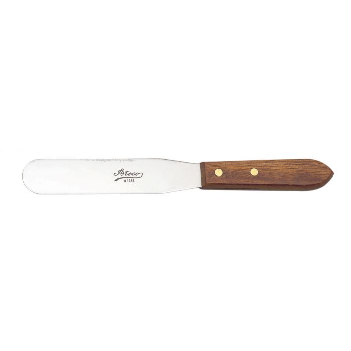 a wooden handled icing spatula on a white background