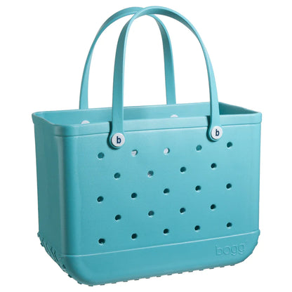 turquoise bogg bag on a white background