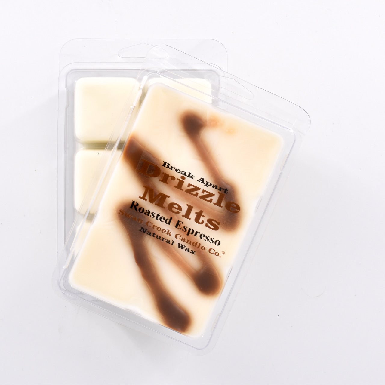 ivory wax with brown swirl across the top in packaging with another package showing the bottom of the wax melts break apart design.