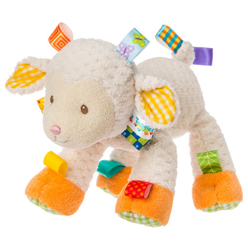 angled view of sherbet lamb stuffed toy on a white background