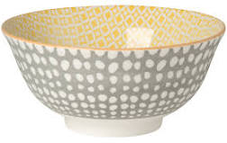 white ceramic bowl with grey and white dots outside and yellow pattern inside.