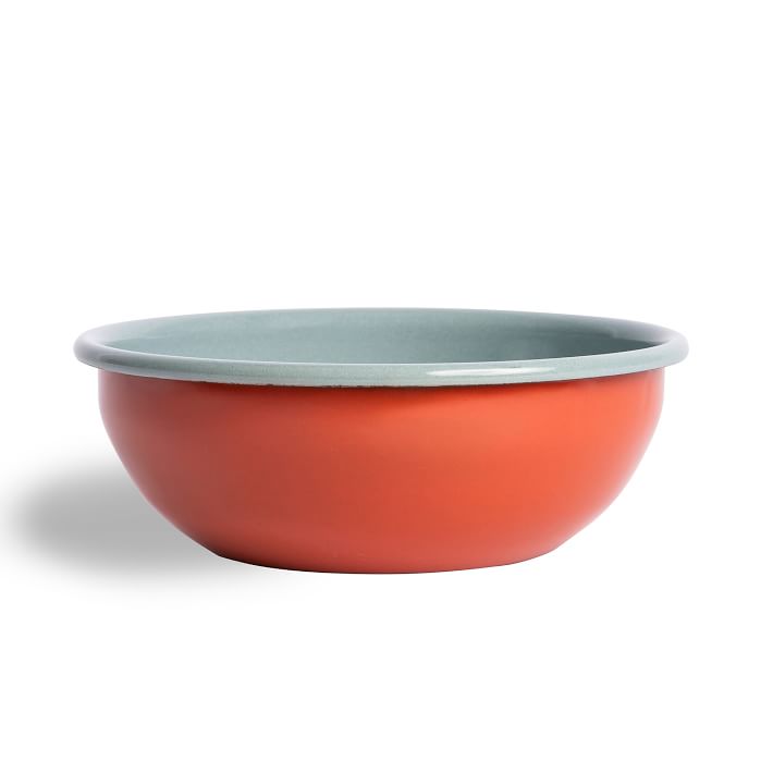 enamel bowl that is deep red on the exterior and light blue on the interior.