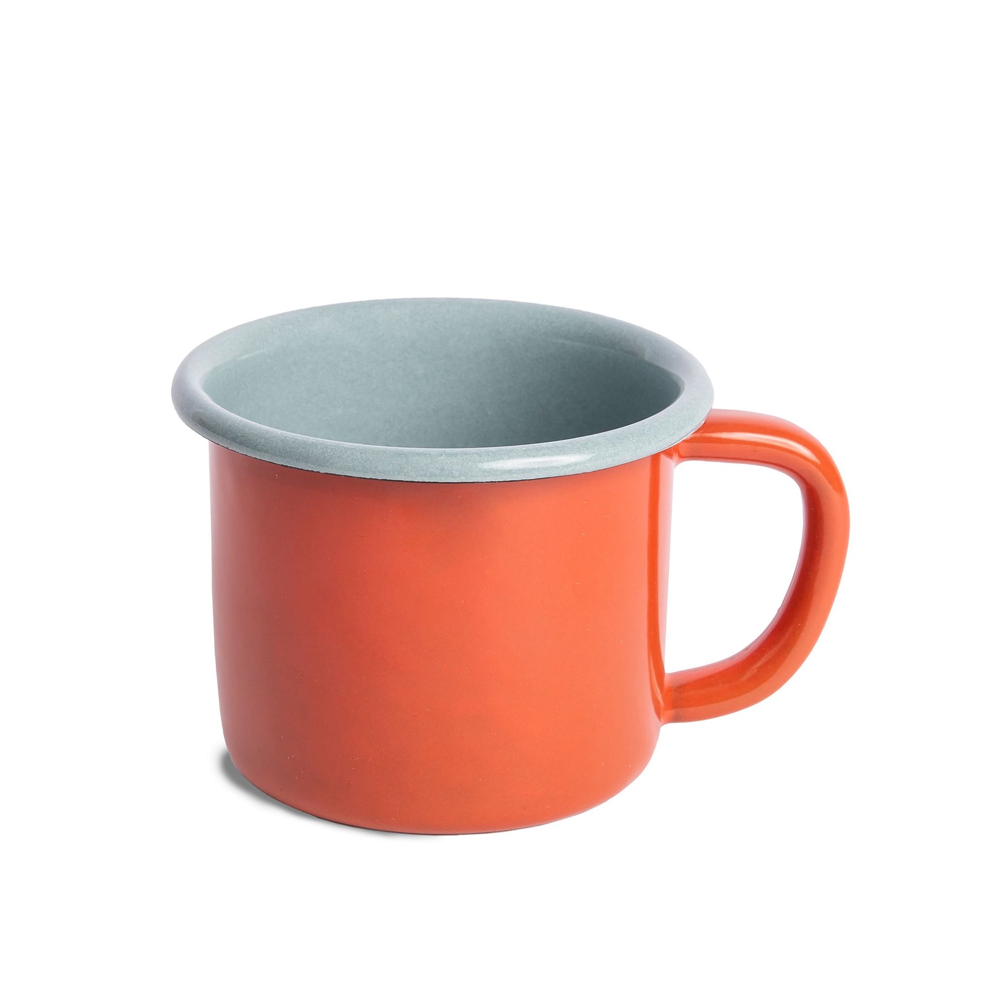 enamel mug that is red on the exterior and light blue on th einterior.