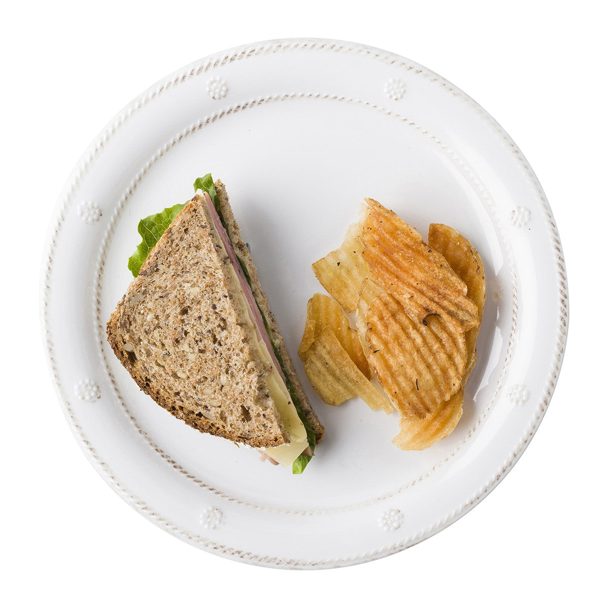 berry and thread melamine salad plate displayed with a sandwich and chips on a white background