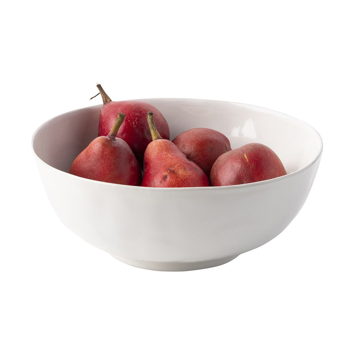 puro serving bowl filled with pears on a white background