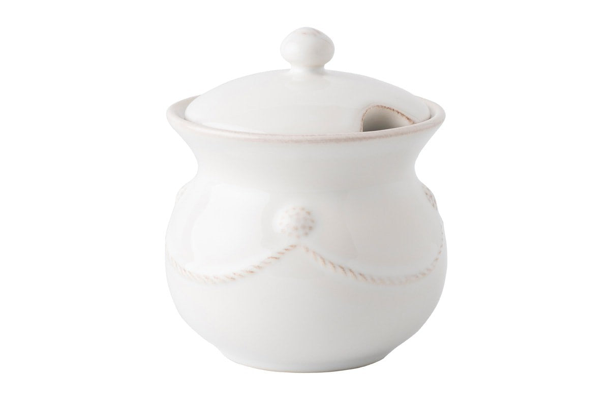 berry and thread sugar pot on a white background