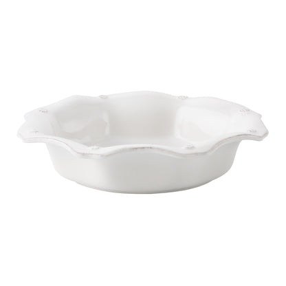 side view of berry and thread pasta bowl on a white background