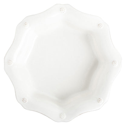 top view of berry and thread pasta bowl on a white background
