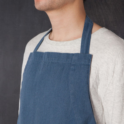 close-up of person wearing apron.