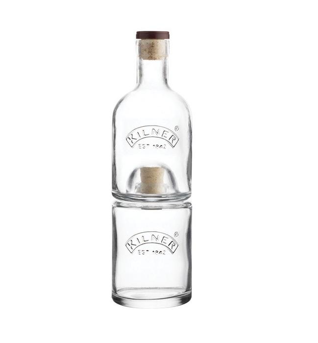 stackable glass bottles with cork lids on white background.
