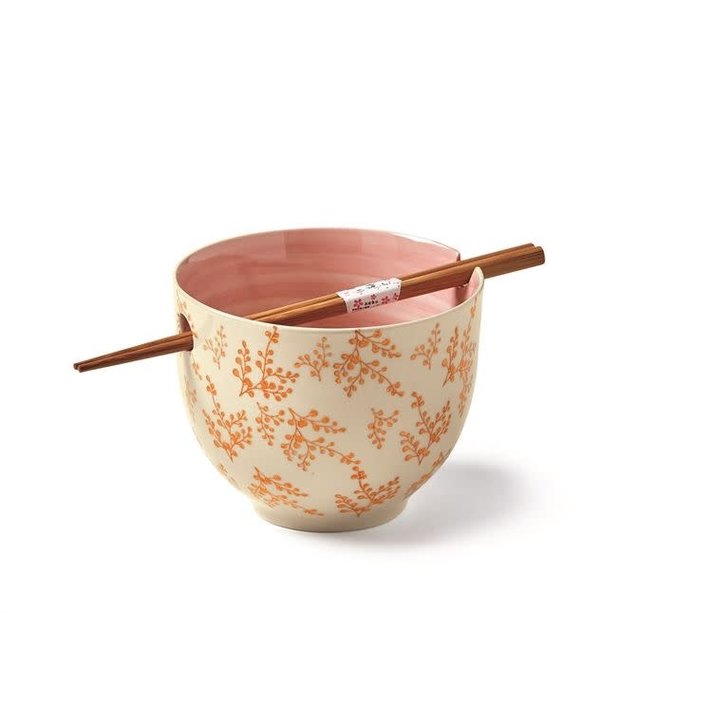 top angled view of the leaf noodle bowl revealing pink inside the bowl on a white background
