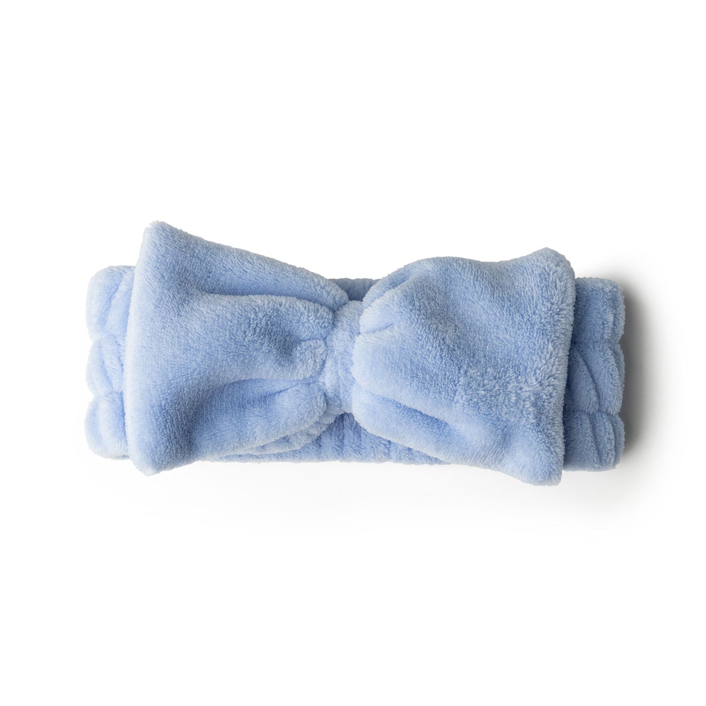 blue take a bow ultra spa headband rolled and displayed on a white background