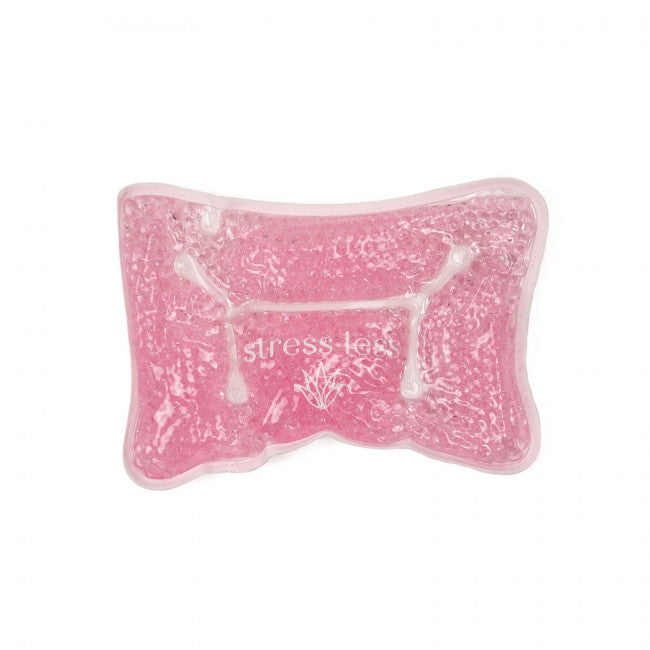 pink stress less spa pillow on a white background