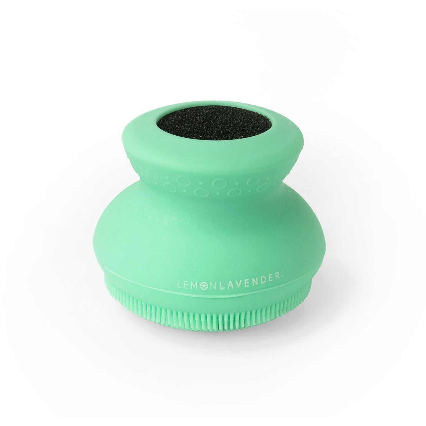 green silicone body scrubber on a white background