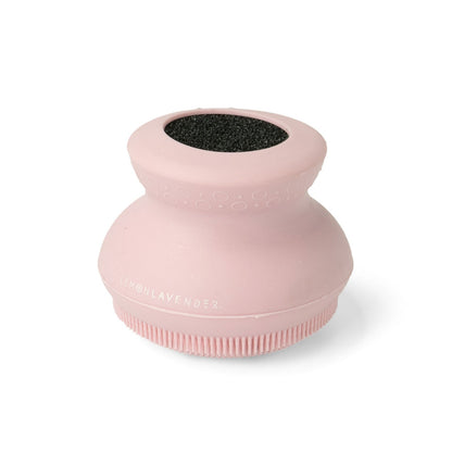 pink silicone body scrubber on a white background