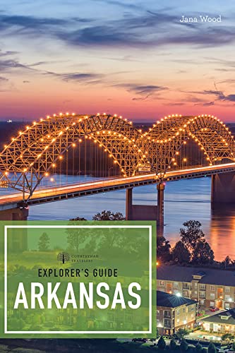 cover of "explores guide to arkansas with image of a river bridge lit up at night.